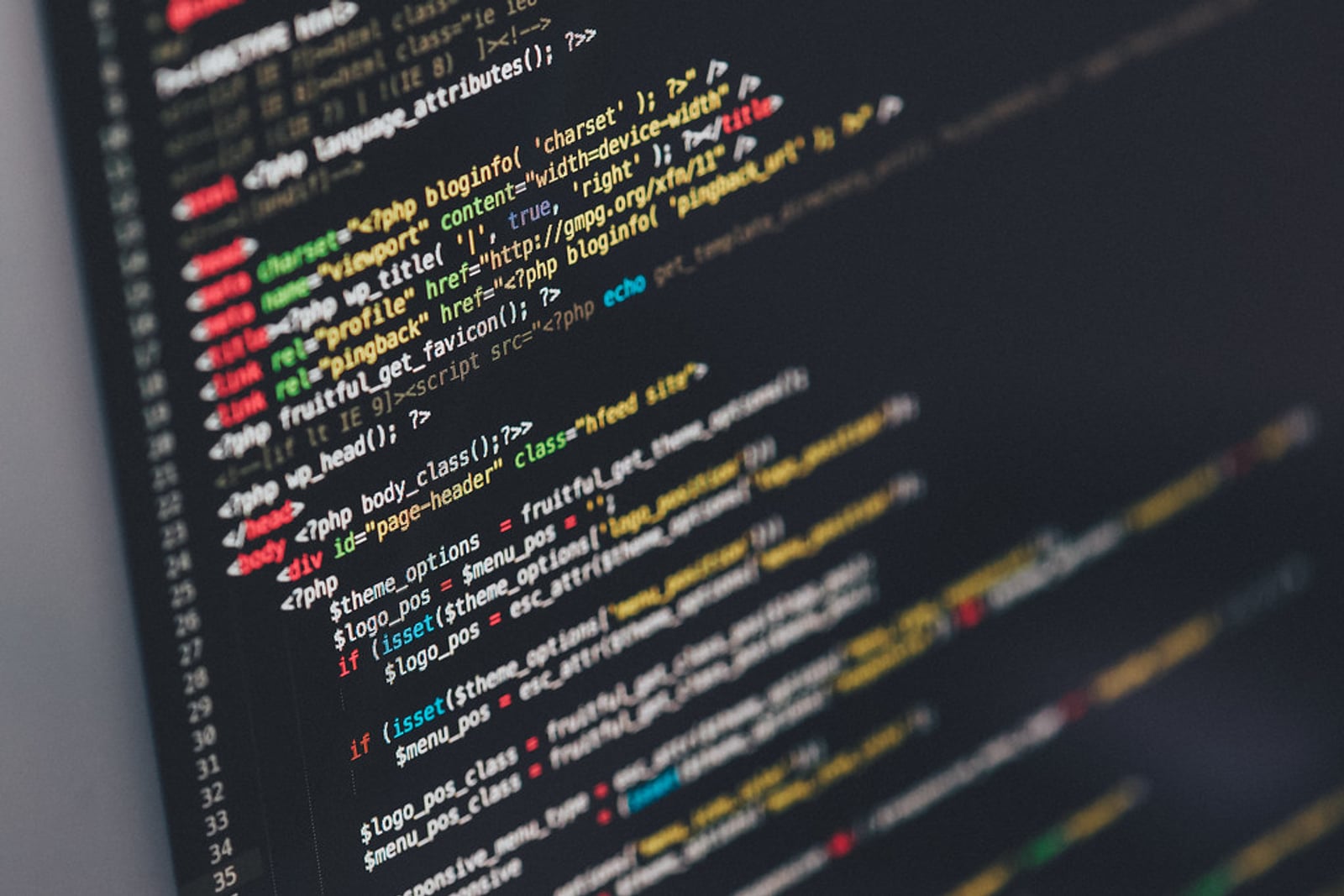 Lines of code on a dark laptop screen.