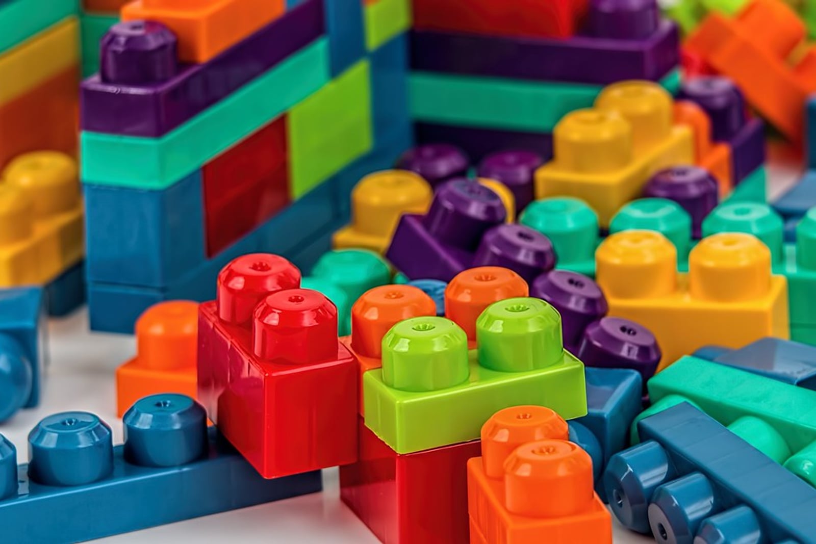 Colorful toy building blocks sorted by color