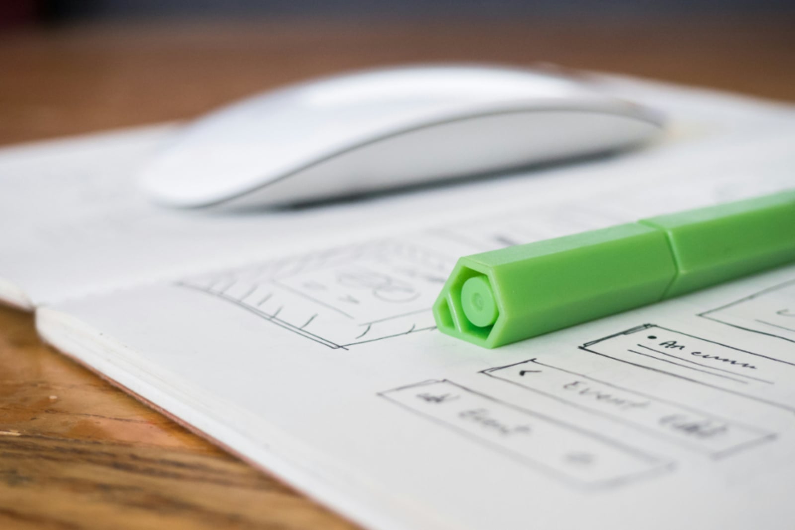 Hand-drawn interface wireframe on paper